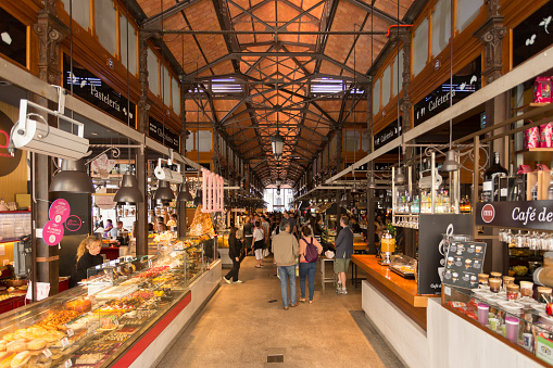 Madrid, Spain - May 31, 2015: Shoppers and diners in the Mercado de San Miguel, Spain. This is a very popular food market that has been renovated and is now full of restaurants, bars and food stalls. 