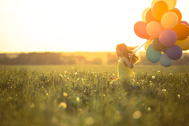 felicidad - child balloon happiness cheerful fotografías e imágenes de stock