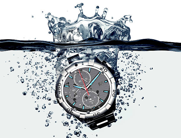 istock wrist watch is splashing in water 493337034