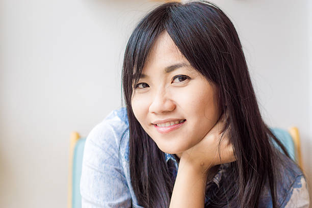 istock Young attractive asian woman relaxing 493337638