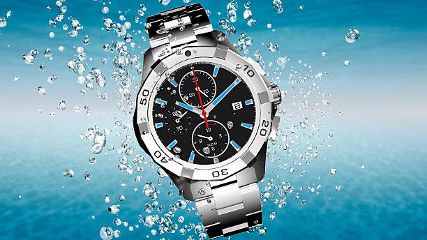 istock wrist watch is splashing in water 493338714