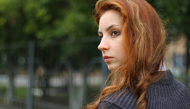 istock red-haired girl in autumn jacket 493339368