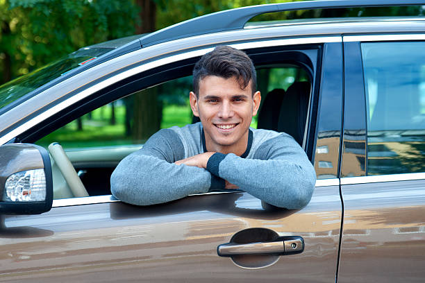 istock young man in his car 493341286
