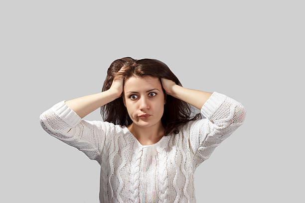 istock portrait headshot terrified young woman 493342100