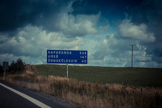 sweden cloudy landscape at road with road sign