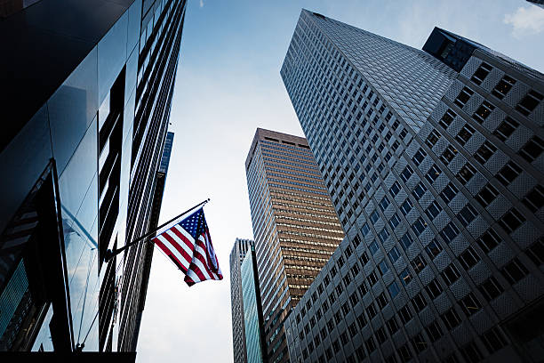 istock High rise buildings and US Flag 493373864