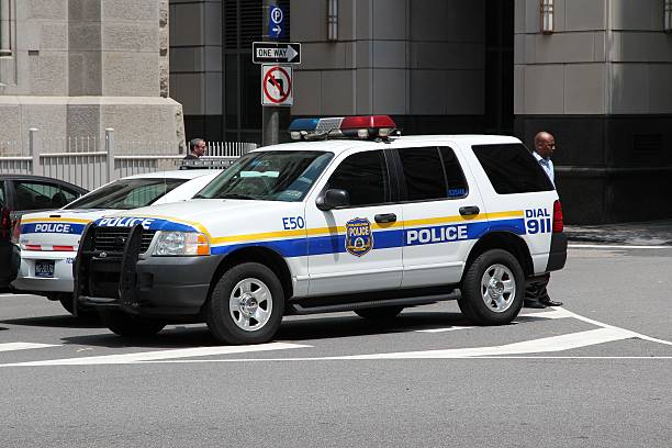 New York, United States - September 21 2009 : a vip diplomatic cars passes over an intersection blocked off by a policeman