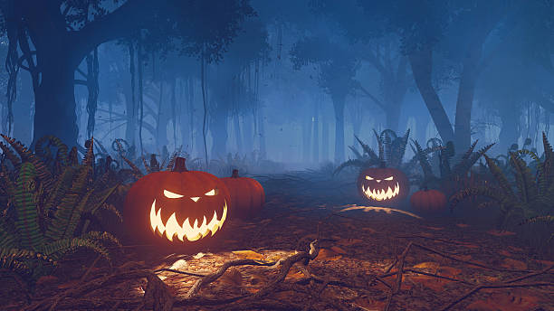 istock Halloween pumpkins in a misty forest close up 493373994