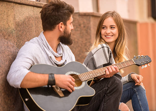 istock Couple with a guitar 493374120