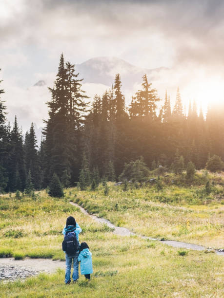 istock mother taking picture with daguhter  at MT.Rainier 493374168