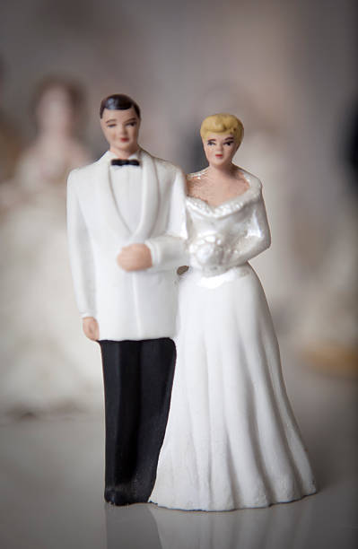 istock Antique bride and groom cake toppers. 493374387