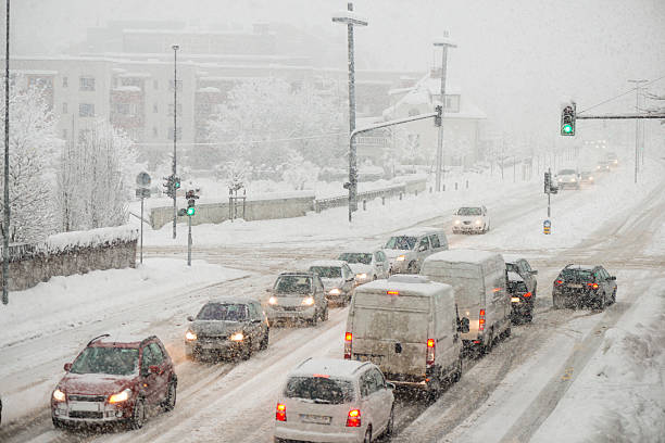 istock Urban traffic on the street in snowfall 493374480