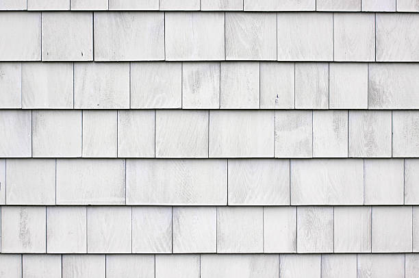 Whitewashed shingle siding Close view of a wall that has whitewashed wood shingles. wood shingle photos stock pictures, royalty-free photos & images