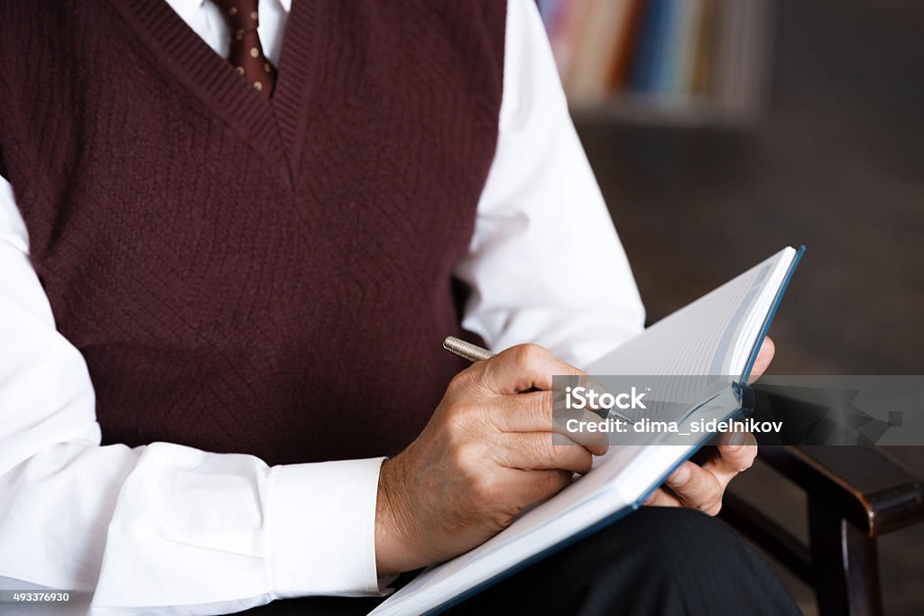 Concept for consultation with psychologist Close up photo of male psychologist. Psychologist making notes in psychologist office 2015 Stock Photo