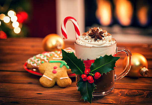 Christmas Hot Chocolate Hot chocolate in front of the fireplace served for Christmas Eve mocha stock pictures, royalty-free photos & images