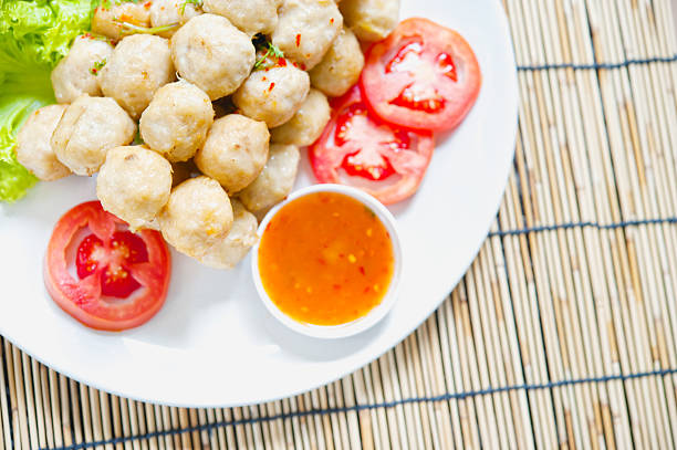 fried meat ball and vegetable on white dish