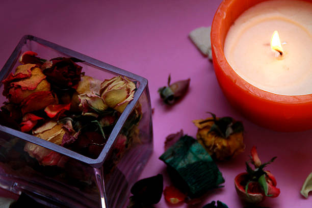istock Jar of flowers and white candle 493377768