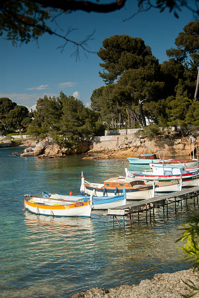 Colourful boats moored on calm bay at sunset, Provence