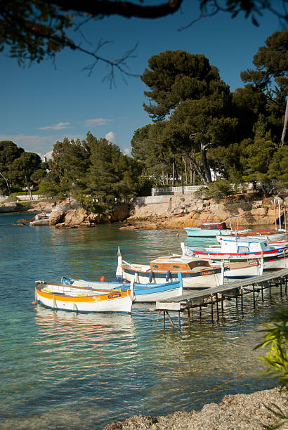 French Riviera View: Fishing boats at Cap d'Antibes stock photo