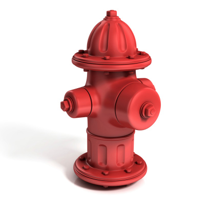 Two modern red fire hydrants in front of an office building.