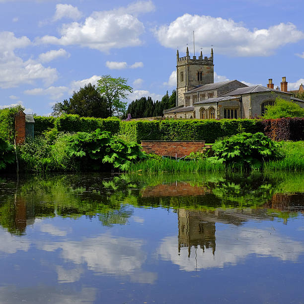 church a church reflected in a lake coughton stock pictures, royalty-free photos & images