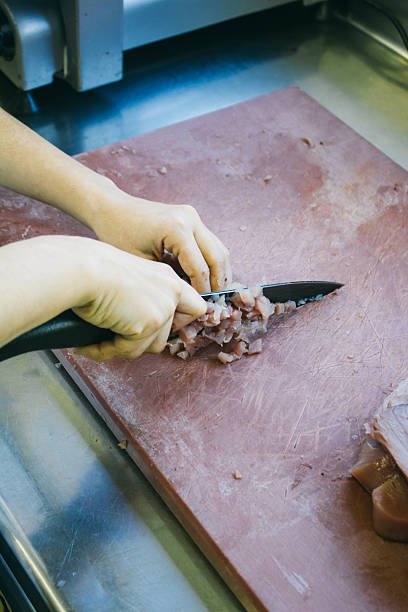 istock Cook chopping a loin of tuna 493379774