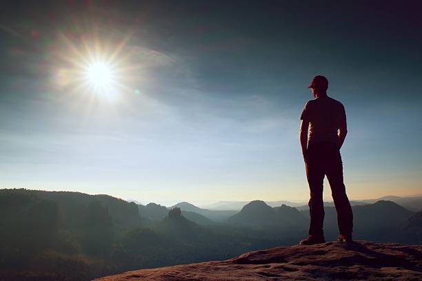 istock Alone man watch over misty morning valley. Beautiful moment 493379952