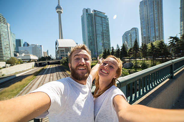 istock Happy lovers enjoying themselves in Toronto-Selfie 493380082