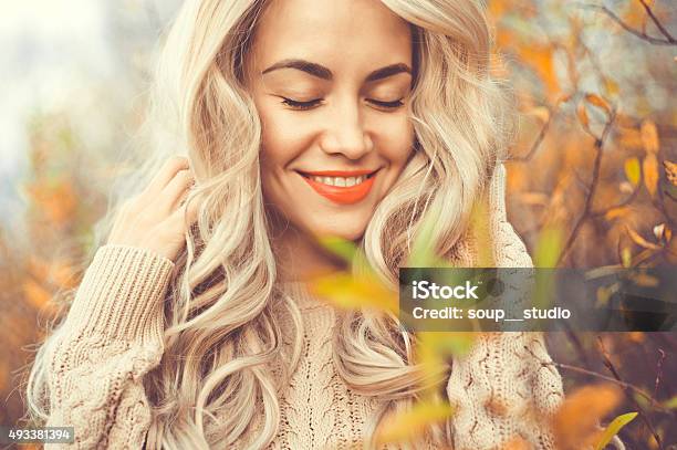 Beautiful Lady Surrounded Autumn Leaves Stock Photo - Download Image Now - Autumn, Women, Beauty