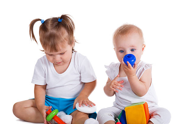 istock Little children playing with toys 493381952