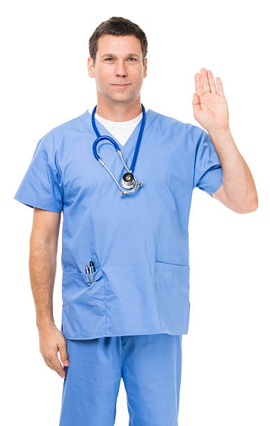 istock Doctor in scrubs on white 493382412