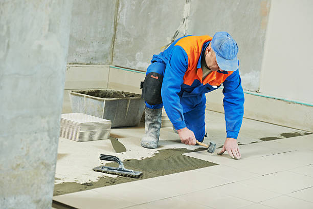 istock tilers at industrial floor tiling renovation 493385942