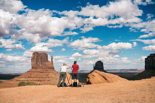 Monument Valley, USA - September 17, 2015: Visitors take pictures of one of the buttes of the National Park