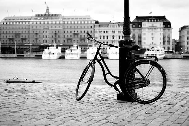 Vintage bike laying against lamp post in front of Grand Hotel Stockholm