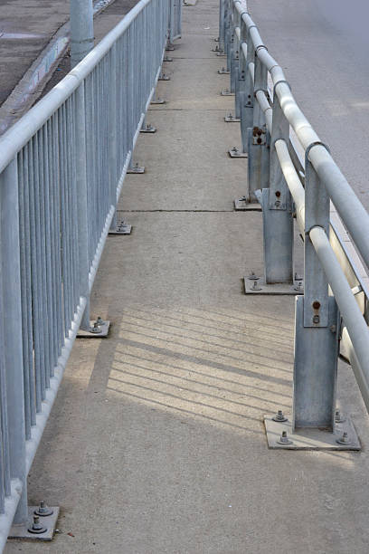 istock fenced walking trail along the highway 493433066