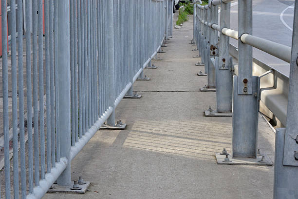 istock fenced walking trail along the highway 493433300