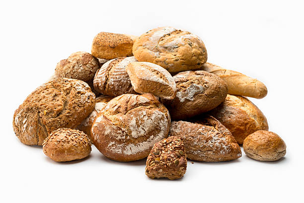 Artisan Bread Stills on white: Variety Assortment of artisan breads isolated on white background bun bread stock pictures, royalty-free photos & images