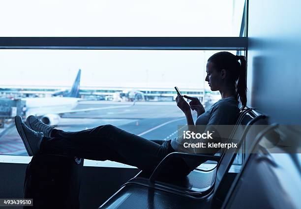 Woman Waiting At The Airport Stock Photo - Download Image Now - Banking, Mobile Phone, Airport