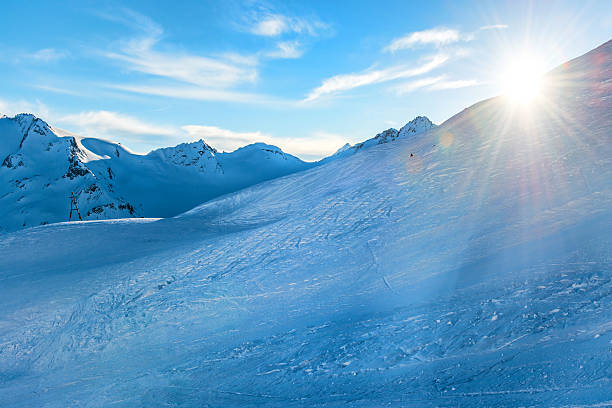 istock Snowy blue mountains in clouds 493440222