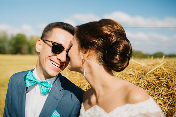 istock bride and groom in the field 493442112