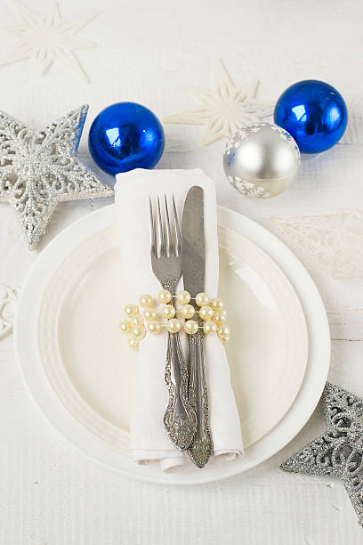 istock Christmas and New year table place setting with christmas decora 493443024