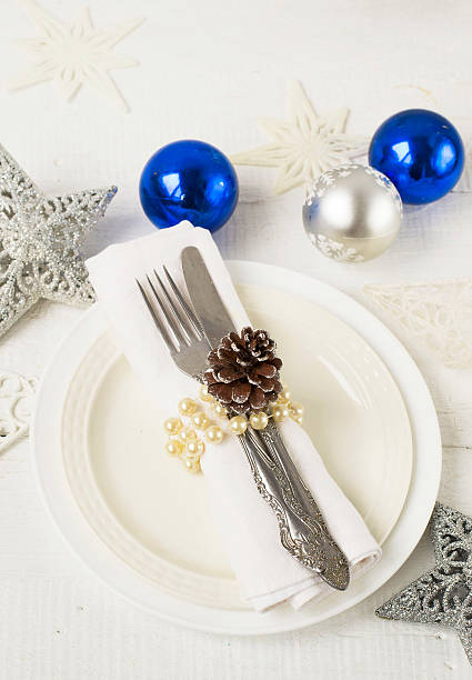 istock Christmas and New year table place setting with christmas decora 493443038
