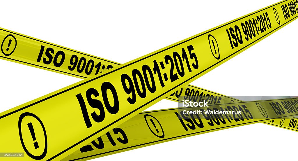 ISO 9001:2015. Yellow warning tapes Yellow warning tapes with inscription "ISO 9001 2015 Stock Photo
