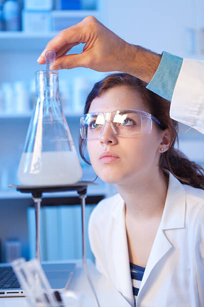 istock Chemistry Student and Teacher Working in Laboratory 493443656
