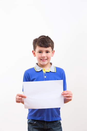 Young Boy Holding Blank Sign On White Background