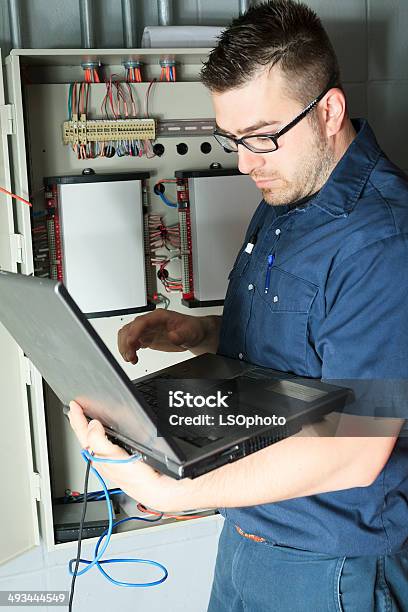 Serviceman Computer Setting Stock Photo - Download Image Now - Radiator - Heater, Adult, Basement