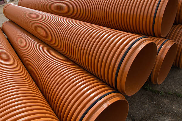 istock Stacked plastic pipes - Tuberias de material Plastico Apiladas 493444780