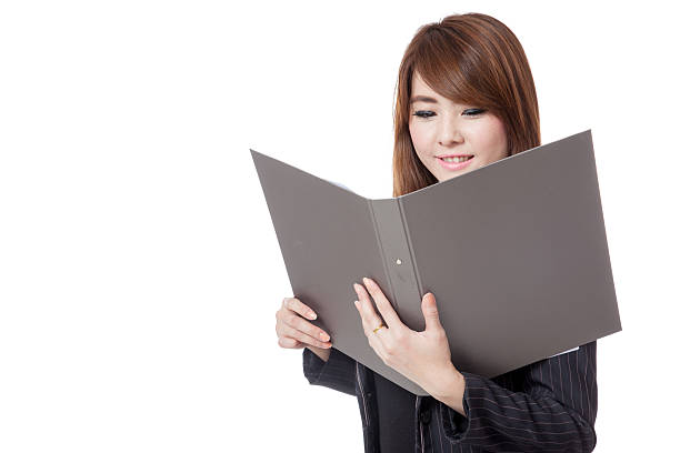 istock Asian office girl  read data from folder and smile 493445015