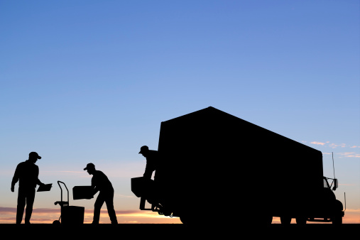 A royalty free image from the transportation industry of a truck unloading.