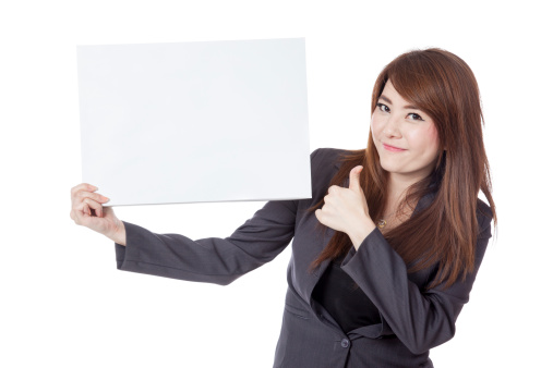 Asian businesswoman  thumbs-up with a blank sign isolated on white background